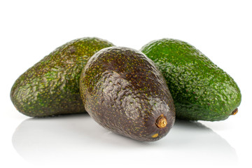 Group of three whole fresh green avocado isolated on white background