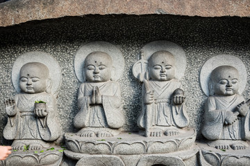 Buddhist sculptures carved on a temple wall  in Wenshu Monastery