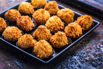 oriental coconut macaron cookies on a rustic surface