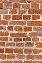 Bright textured red brick wall