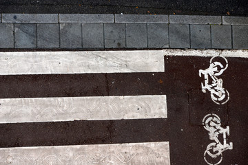 crosswalk and bike path paint on road seen from above