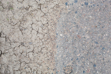 dirty dried ground and asphalt