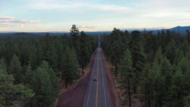 Highway road with cars in Deschutes Forest, Oregon. Aerial drone shot.
