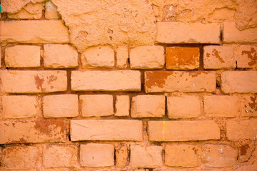 Obraz premium Old damage brick wall with colorful graffiti