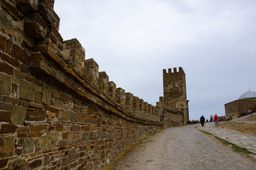 The wall of the old fortress, towers and structures, the ruins of the old fortress.