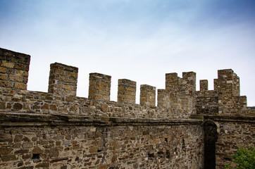 The wall of the old fortress, towers and structures, the ruins of the old fortress.