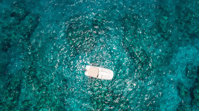 Empty Deck Boat Anchored On Molasses Reef In Florida Keys