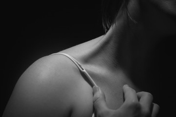 Intimate soft shoulder skin of a caucasian woman in her bra
