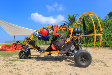 Moto paraglider on the beach