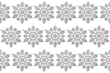 new year concept. seamless pattern of Christmas decor in the form of silver snowflakes on a white background. top view, flat layout