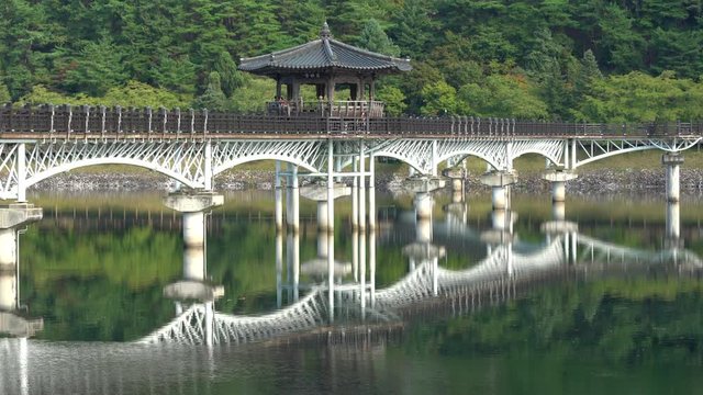 View of Weolyeonggyo bridge and pavilion with water reflection a wooden bridge spanning the Nakdong River in Andong South Korea