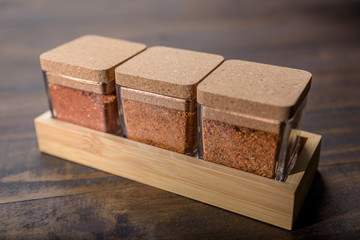 spices set on wooden table cumin and glass set