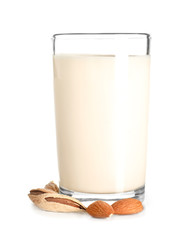 Glass of fresh almond milk on white background