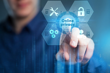 Business, Technology, Internet and network concept. Young businessman working on a virtual screen of the future and sees the inscription:Online privacy.