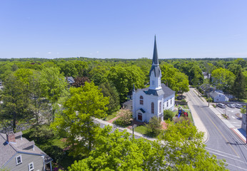Aerial view of First Baptist Church at Medfield historic town center on Main Street in summer,...