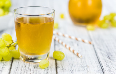 Grape Juice (fresh) as detailed close-up shot, selective focus)