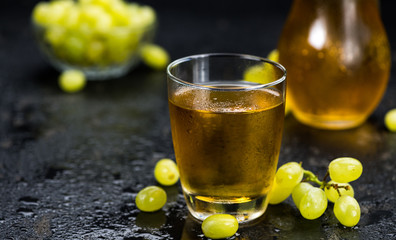 Grape Juice (fresh) as detailed close-up shot, selective focus)