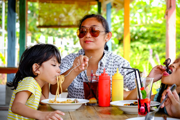 Southeast Asian Ethnicity Family Lifestyle, Mother Having Lunch Together with Her Kids at A Restaurant