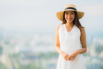 Portrait beautiful young asian woman happy smile relax on the roof top bar