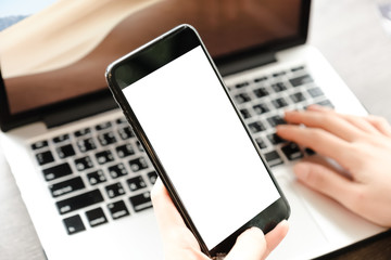 Close up of woman using cell phone,sending massages on the garden.having sunbath.Phone with black screen,texting,video calls,