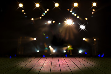 top desk with light bokeh in concert blur background,wooden table