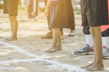 Students fitness training for sprinting on an athletic track in school.