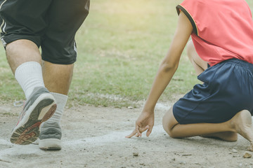 Students fitness training for sprinting on an athletic track in school.