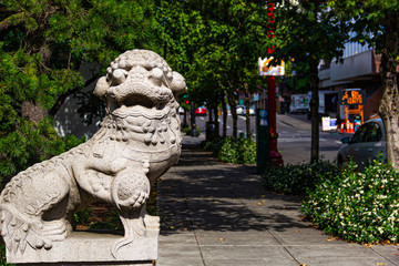 Dragon sculpture in the city sidewalk 
