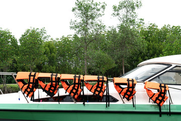 black orange life jacket on stainless steel line