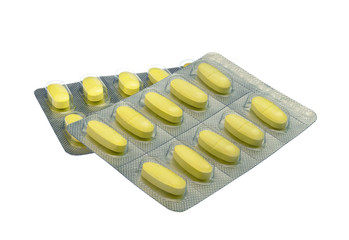 blister pack of yellow tablets pill isolated on white background