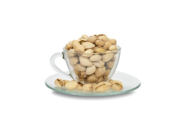 Closeup pistachios nut dry roasted and salted in a transparent glass isolated on white background,clipping path
