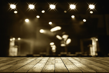 top desk with light bokeh in concert blur background,wooden table