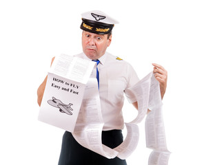 The pilot looks into instructions about using the aircraft, isolated on white background. Aircraft...
