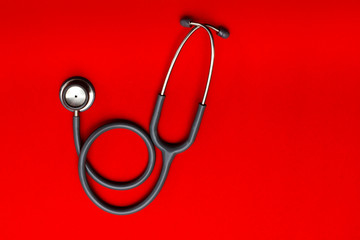 Stethoscope  on a red background