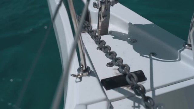 Close-up of nautical anchor winch and chain on a luxury super yacht. Slow motion