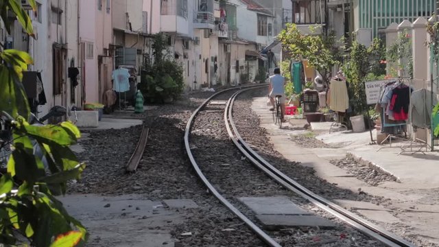 Nha Trang, Kh&aacute;nh H&ograve;a / Vietnam - 10.06.2019 passengers walk on the platform of the railway station in Vietnam, get into the car, inspect the train and wait