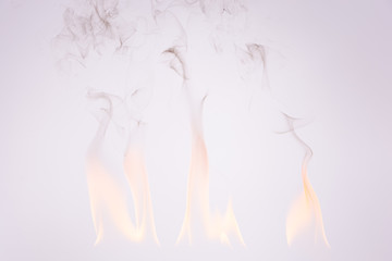 Fototapeta na wymiar Fire and smoke in a white background