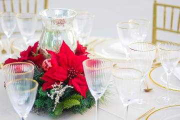 Christmas table on a exterior yard, with gold setup.
