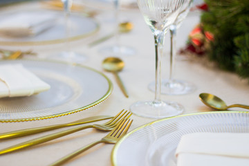 Christmas table on a exterior yard, with gold setup.