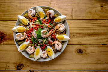 YUM , Spicy Thai food, Salad,Eggplant salad, fresh shrimp, boiled egg,Original Thai food, spicy grilled eggplants salad with boiled egg and shrimp in a banana leaf plate.