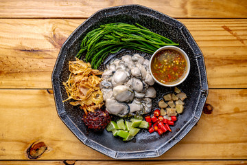 Oysters,Spicy Oyster Salad,Yum, Oyster and side dishes in Thai style, Thai style oysters with spicy dipping sauce © คุณ ศรัญ
