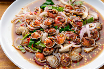Cockle Salad,Cockles salad / Hot and spicy shellfish blood cockles salad mix vegetable tomato herb and spices thai style food