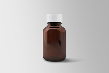 Brown plastic bottle for pills isolated on soft gray background