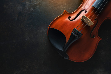 Violin on a black background,Classical violin isolated on dark background. Studio shot of old violin. Classical musical instrument,Top view violin black background