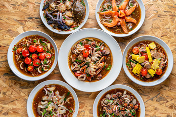 Yum, Spicy salad, spicy Thai food, mixed on the table,Collection set of Spicy salad (Yum Thai style) Traditional spicy -hot seafood, egg Thai food. Thai cuisine delicious food popular 