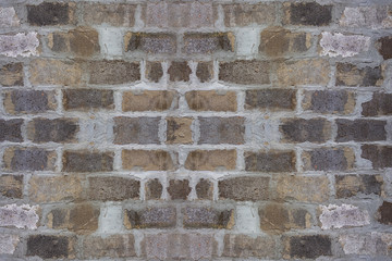Gray block wall background. Grey textured building exterior surface with rough stacked big bricks. Tiled structure of stonewall for backdrop designs