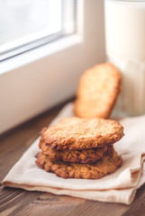 Oatmeal cookies on a window background, healthy eating. Breakfast or evening snack