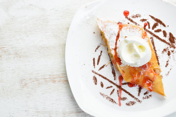 Apple strudel with ice cream. Top view. Free space for your text.