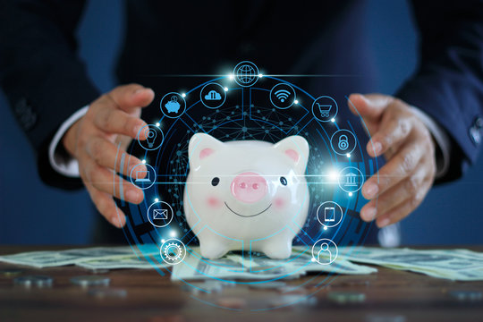 Businessman protect piggy bank and online banking, Financial and payment, Digital marketing, Online shopping and icon customer network connection, Cyber security, on virtual screen blue background.