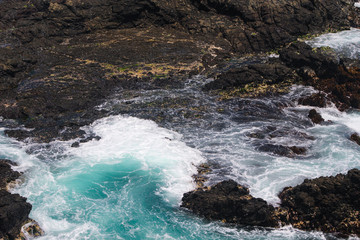 waves crashing on rocks